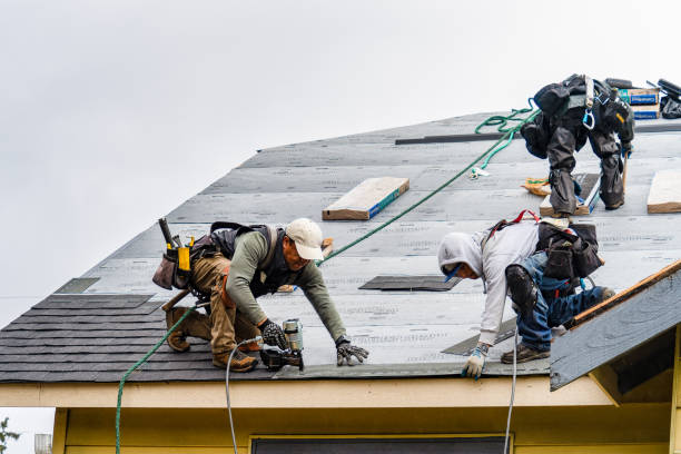 Professional Roofing technician working in Roosevelt, NY